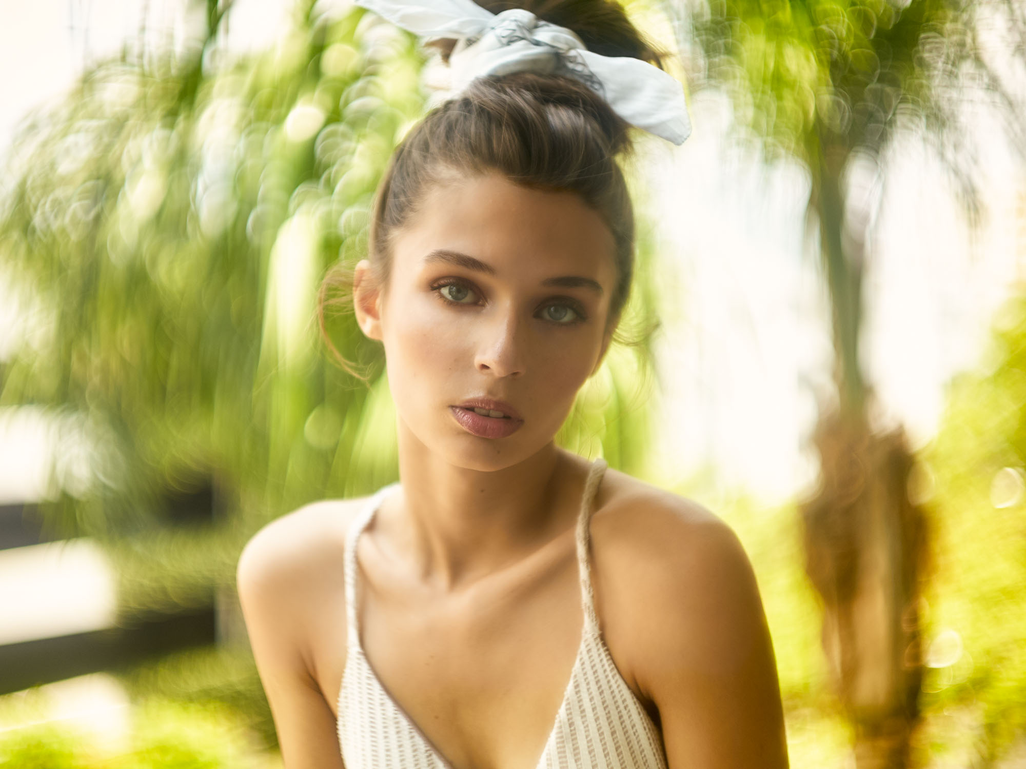 Outdoor fashion photo of Wilhelmina model Isabella Scaffidi shot on Leica, looking back with tousled hair for a candid, effortless vibe
